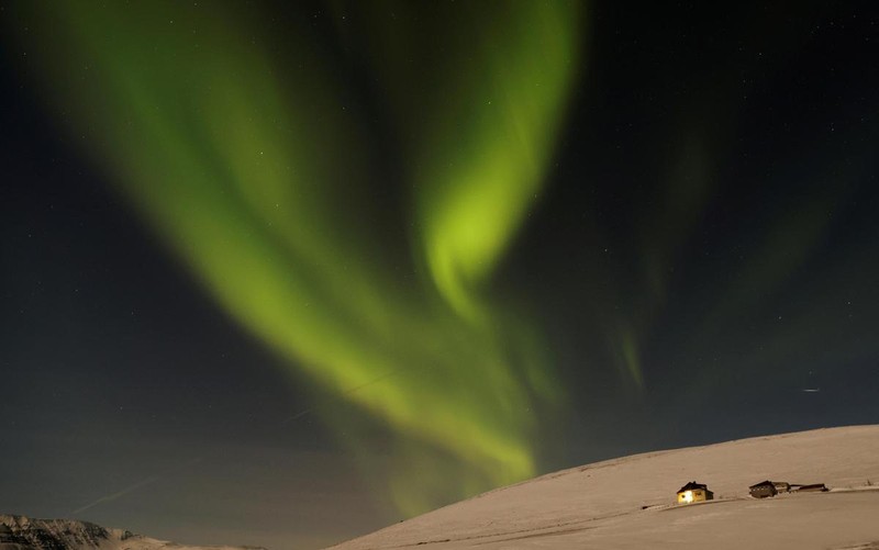 Cực quang huyền ảo trên bầu trời mùa đông ở Husavik, Iceland, ngày 13/2/2022.