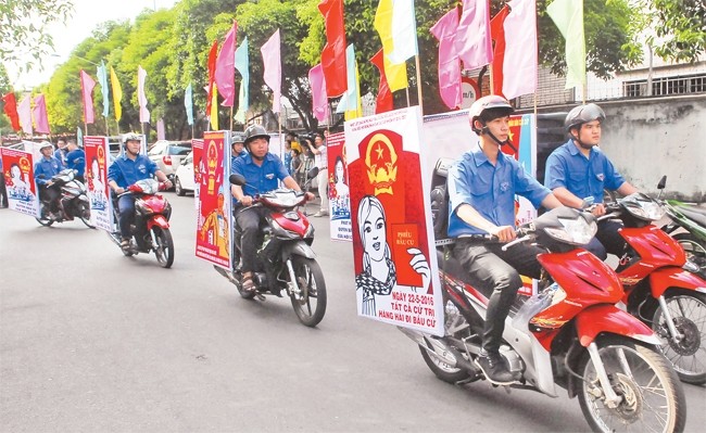 Diễu hành cổ động chào mừng ngày bầu cử Quốc hội và HĐND các cấp ở TP Hồ Chí Minh. Ảnh: MẠNH LINH (TTXVN)